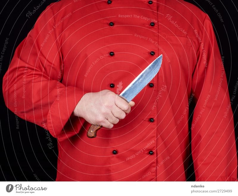 chef in red uniform holding a kitchen knife Knives Kitchen Restaurant Profession Cook Human being Man Adults Hand Steel Stand Red Black blade Caucasian chopping