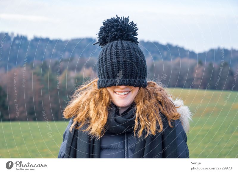 Young woman with a blue cap over her face Lifestyle Joy Leisure and hobbies Winter Hiking Feminine Youth (Young adults) Face 1 Human being 18 - 30 years Adults