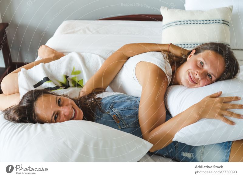 Happy homosexual women couple on bed Woman Couple Homosexual Love Lie (Untruth) Bed Smiling girlfriend Relationship Human being Beautiful Together romantic Home