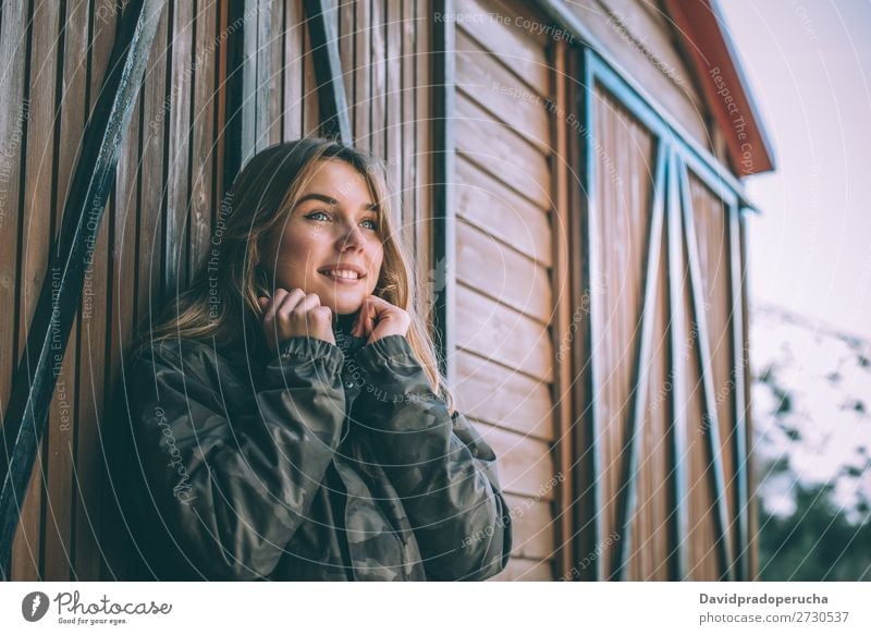 portrait Young pretty woman in winter in a log cabin in the snow Portrait photograph Winter Woman Snow Youth (Young adults) Happy Hut Log Wood Cute Blonde