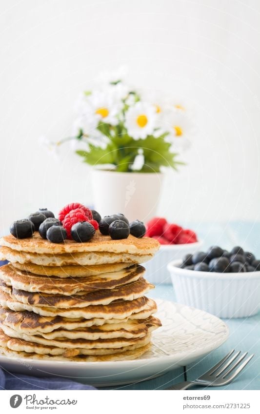 Pancakes with raspberries and blueberries Candy Dessert Breakfast Blueberry Raspberry Berries Red Baking Food Healthy Eating Food photograph Dish Plate isolated