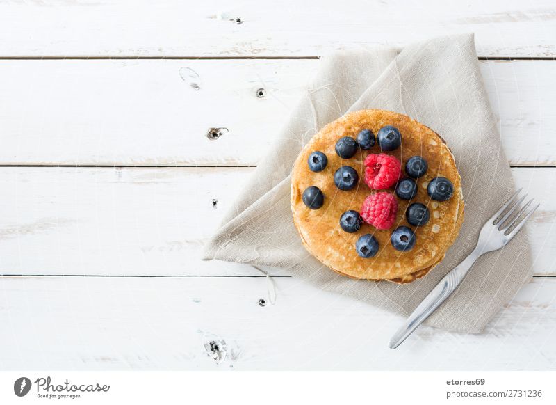 Pancakes with raspberries and blueberries Candy Dessert Breakfast Blueberry Raspberry Berries Red Baking Food Healthy Eating Food photograph Dish Plate isolated