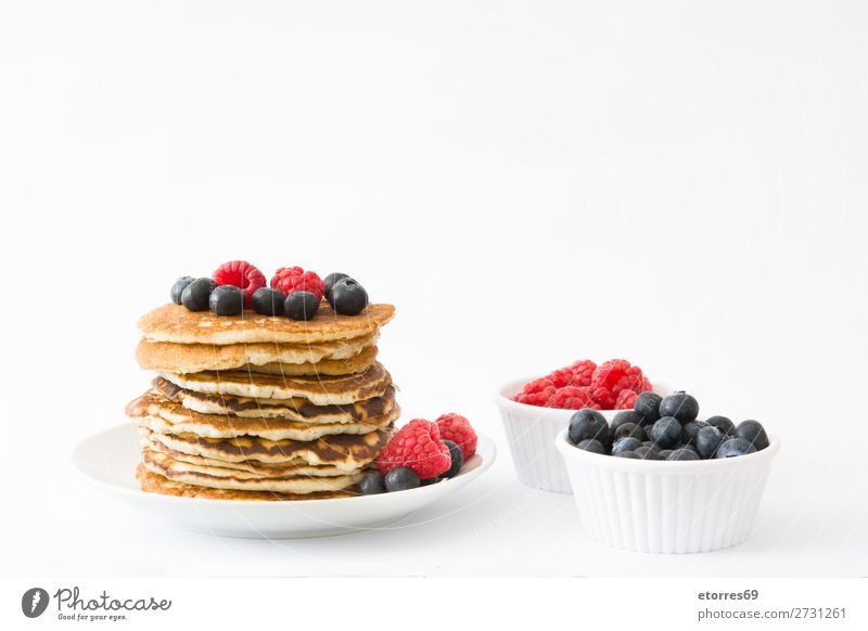 Pancakes with raspberries and blueberries isolated Candy Dessert Breakfast Blueberry Raspberry Berries Red Baking Food Healthy Eating Food photograph Dish Plate