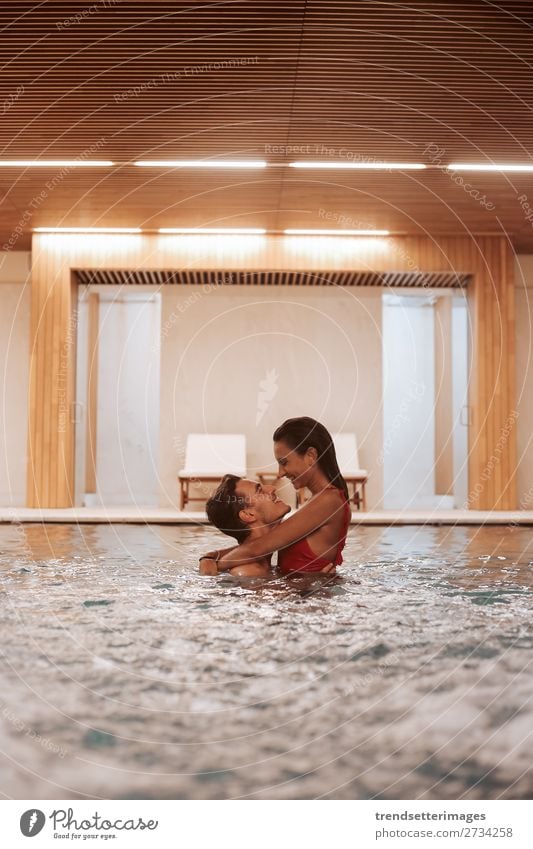 Couple In Love At Luxury Hotel Lifestyle Joy Happy Beautiful Wellness Relaxation Spa Swimming pool Leisure and hobbies Woman Adults Man Waterfall Smiling water