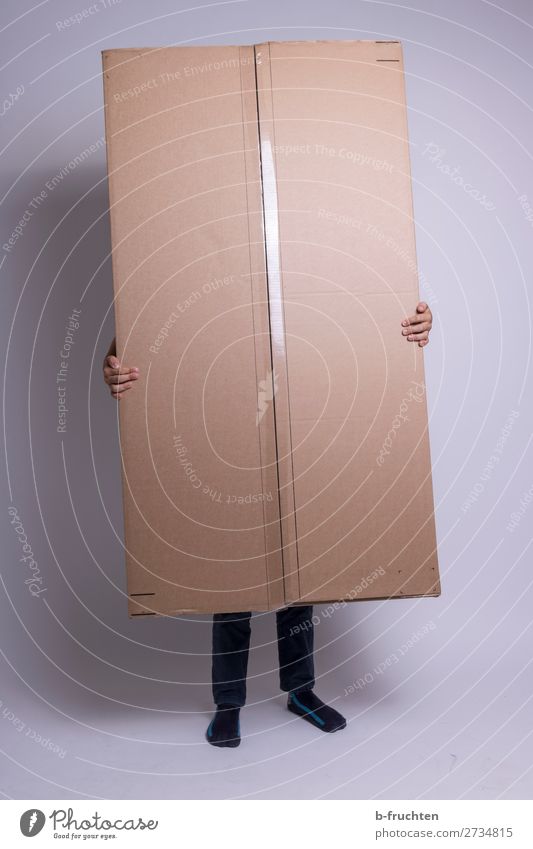 Person with large package Hand Fingers Legs 1 Human being Packaging Container Touch To hold on Stand Hide Cardboard Package parcel service Colour photo