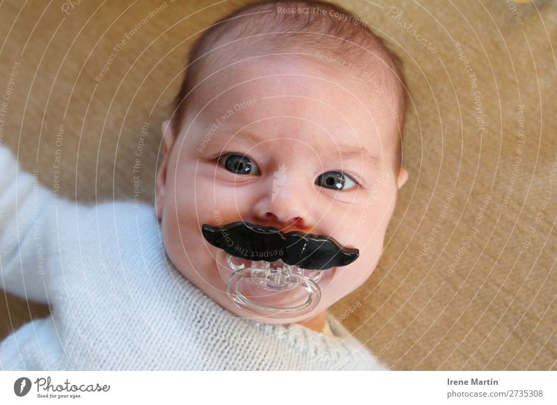 Baby with a big moustache Parenting Human being Feminine Child Toddler Girl Infancy Face Eyes 1 0 - 12 months Short-haired Moustache Toys Observe Looking Blonde