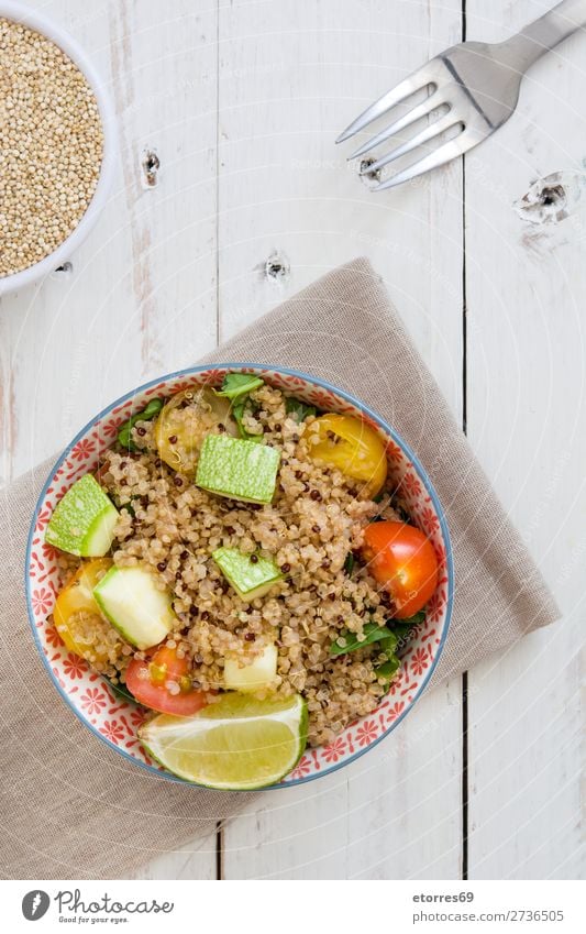 Quinoa with tomatoes, zucchini and lime quinoa Vegan diet Vegetable Tomato Spinach Bowl Healthy Healthy Eating Diet Heap Grain Agriculture Preparation Crunchy