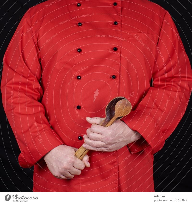 chef in red uniform holding old wooden spoons Spoon Kitchen Restaurant Profession Cook Human being Man Adults Hand Wood Stand Red Black Caucasian chopping