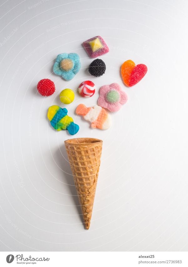 Ice cream cone with jelly candies on white background Dessert Summer Gastronomy Fashion Fresh Delicious Yellow Red White Colour Calorie candy cold colorful