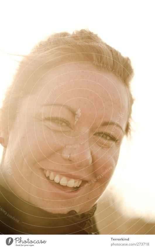 Hiddensee. Woman Laughter Smiling Strong Character Human being Teeth Mouth Piercing Jacket Collar Sun Back-light Hair and hairstyles beautiful.