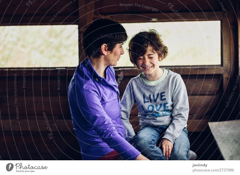 Mother and daughter laughing in a cabin in the countryside Lifestyle Joy Happy Beautiful Face Leisure and hobbies Playing House (Residential Structure) Child