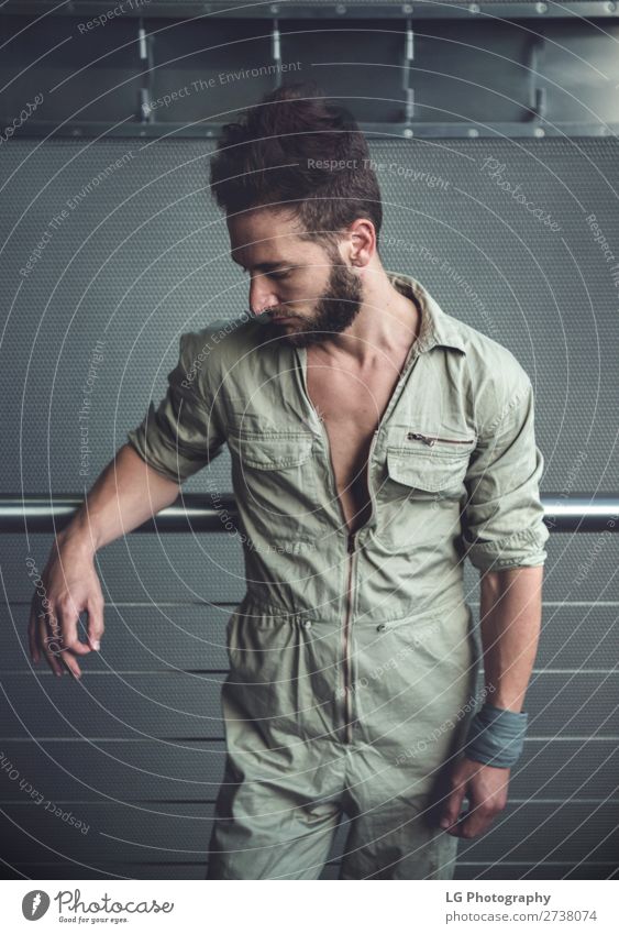 Portrait of a man in a jumpsuit Beautiful Body Calm Masculine Homosexual Man Adults Building Fashion Beard Metal Simple Eroticism Modern Gray White hair Khaki