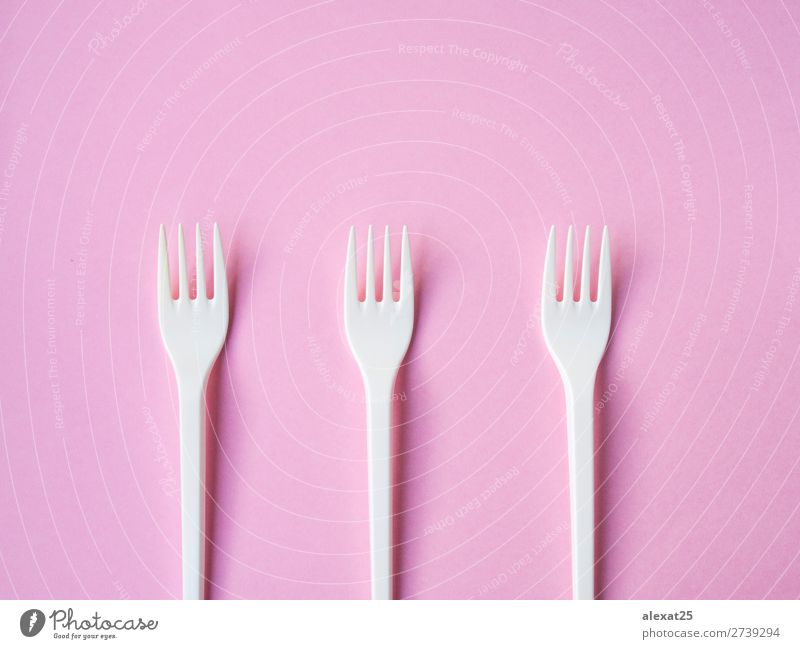 Plastic fork pattern on pink background Cutlery Fork Design Table Kitchen Accessory Bright White Colour colorful copy eat equipment forks Horizontal isolated