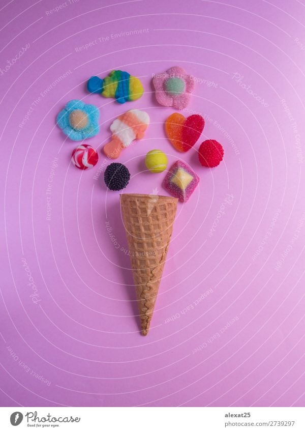 Ice cream cone with jelly candies on pink background Dessert Summer Gastronomy Fashion Fresh Delicious Yellow Pink Red White Colour Calorie candy cold colorful