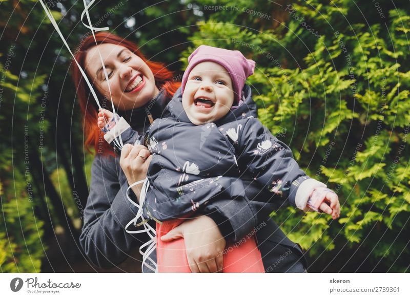 happy family: young mother walks with her child in the Park Lifestyle Leisure and hobbies Playing City trip Mother's Day Human being Feminine Baby Adults