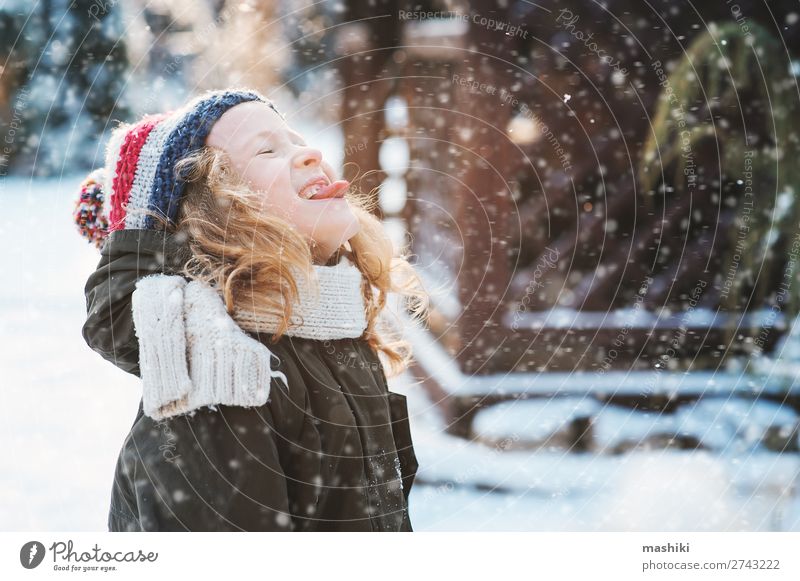 happy child girl catching snowflakes and playing Joy Happy Playing Knit Vacation & Travel Winter Snow Garden Child Weather Forest Scarf Hat Drop Smiling