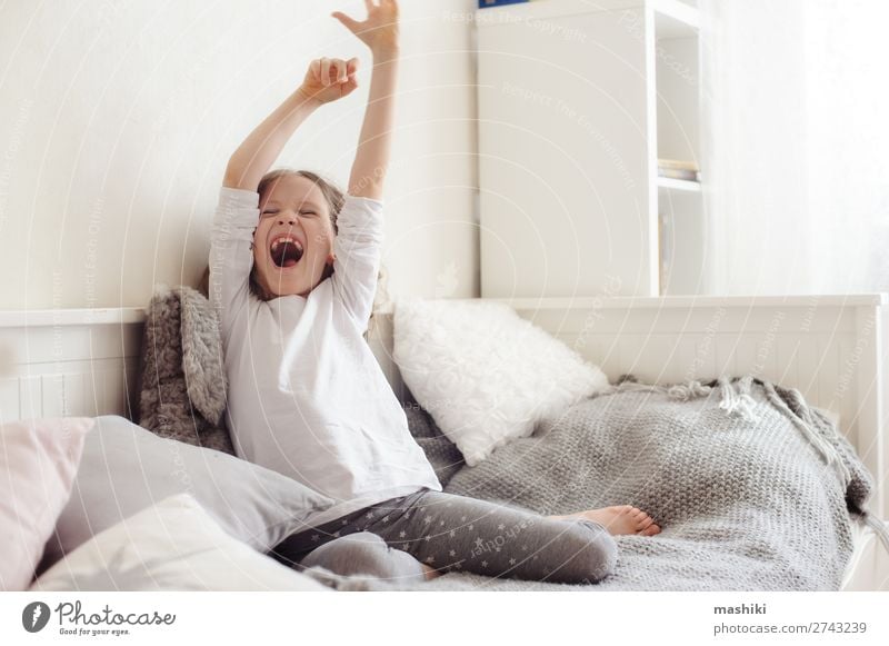 happy sleepy kid girl stretching in her room Lifestyle Joy Happy Relaxation Playing Bedroom Child Infancy Toys Teddy bear Smiling Laughter Sleep Embrace Modern