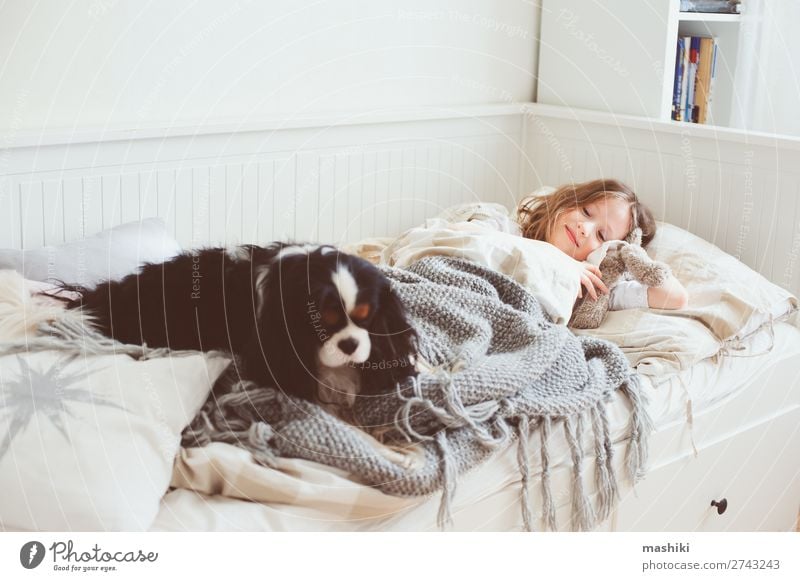 happy kid girl waking up in the morning Lifestyle Joy Happy Relaxation Playing Bedroom Child Friendship Infancy Pet Dog Smiling Laughter Sleep Modern White Home