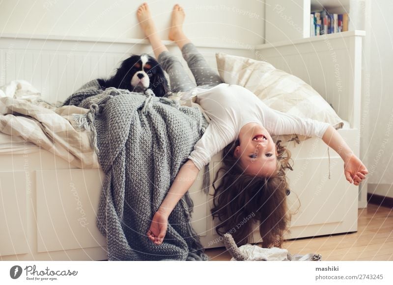 happy kid girl waking up in the morning Lifestyle Joy Happy Relaxation Playing Bedroom Child Friendship Infancy Pet Dog Smiling Laughter Sleep Modern White Home