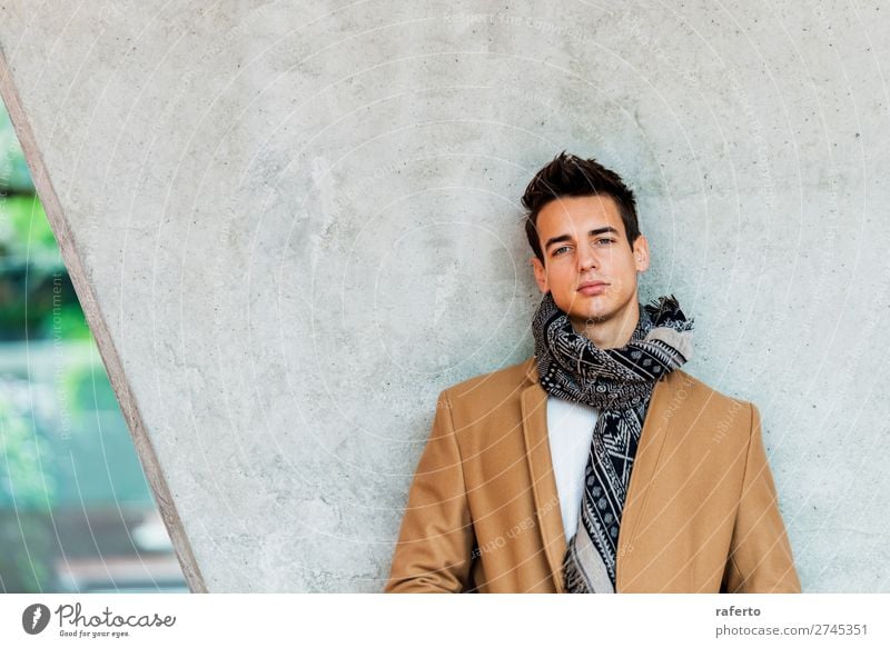 Young man wearing coat and scarf leaning on a wall Lifestyle Elegant Style Beautiful Hair and hairstyles Human being Masculine Youth (Young adults) Man Adults 1