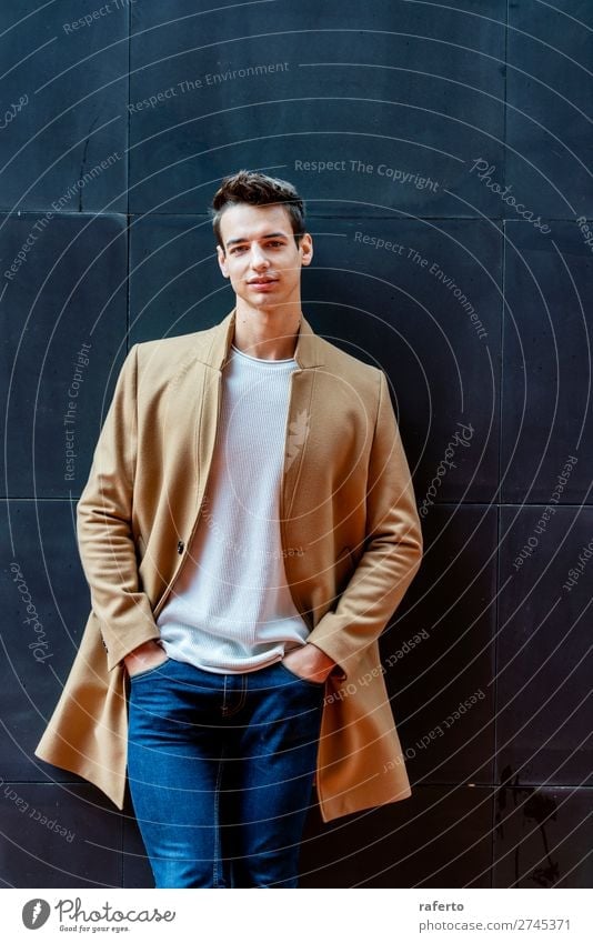 Fashionable young man standing against black wall Elegant Style Beautiful Hair and hairstyles Human being Masculine Young man Youth (Young adults) Man Adults