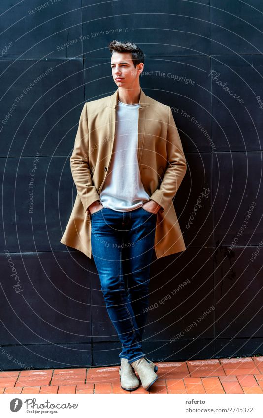 Fashionable young man standing against black wall Elegant Style Beautiful Hair and hairstyles Human being Masculine Young man Youth (Young adults) Man Adults 1