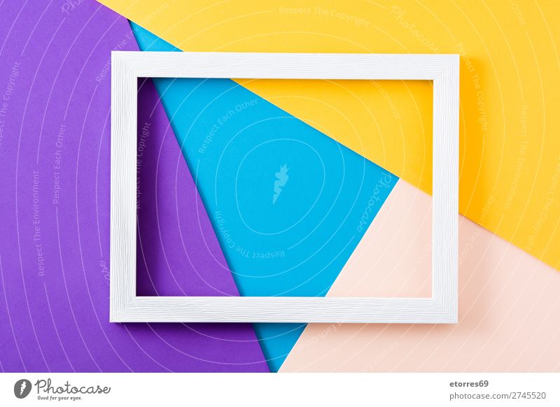 White wooden frame on colorful background. Frame Mock-up Wood Colour Multicoloured Neutral Background Copy Space Yellow Purple Blue Easter Abstract Empty