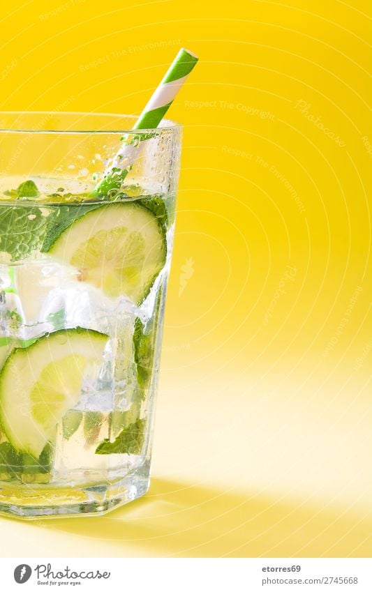 Mojito cocktail in glass on yellow background Cocktail Beverage Drinking Alcoholic drinks Refreshment Summer Lime Green Mint Juice Rum Cold Ice Mixer Fruit