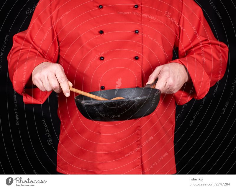 cook holding an empty black frying pan Pan Spoon Kitchen Restaurant Profession Cook Human being Man Adults Hand Clothing Red Black Cast iron Caucasian chef