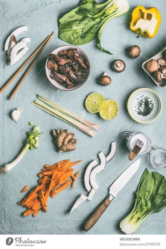 Asian cuisine ingredients on kitchen table Food Vegetable Herbs and spices Nutrition Organic produce Vegetarian diet Diet Asian Food Crockery Bowl Knives Style