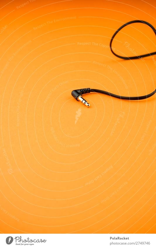 #S# plug in Lifestyle Orange Music Connector Headphones Plugin Black Jack plug Listening Leisure and hobbies Listen to music Colour photo Interior shot Close-up