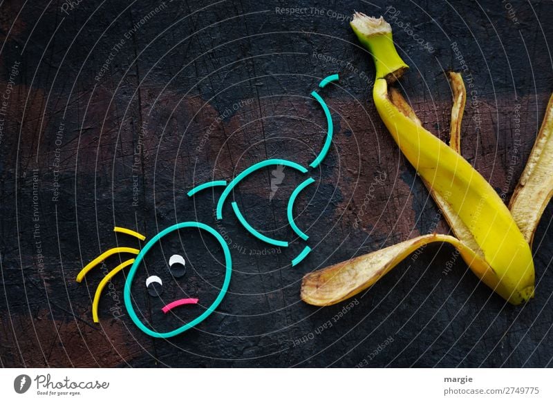 Rubber worms: Slip! A person slips on a banana Nutrition Human being Masculine Woman Adults Man 1 Brown Yellow Dangerous Stress Aggravation Frustration Banana