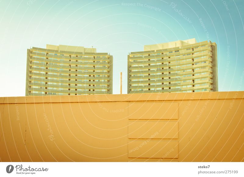 mirror axis Cloudless sky Summer Beautiful weather House (Residential Structure) High-rise Wall (barrier) Wall (building) Retro Town Blue Orange Symmetry