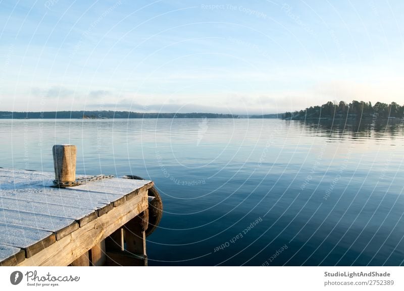 View over a calm lake Beautiful Relaxation Calm Island Winter Nature Landscape Sky Coast Lake Wood Natural Blue Serene jetty quayside water lakeshore Sunset