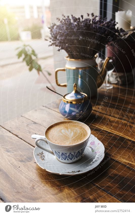 Cappuccino coffee in vintage porcelain cup on the wooden table. Breakfast Beverage Coffee Espresso Shopping Table Restaurant Flower Wood Fresh Hot Brown Colour