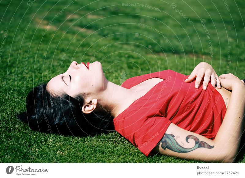 beautiful woman lying on the grass of a park Lifestyle Style Beautiful Summer Garden Human being Feminine Young woman Youth (Young adults) Woman Adults Body