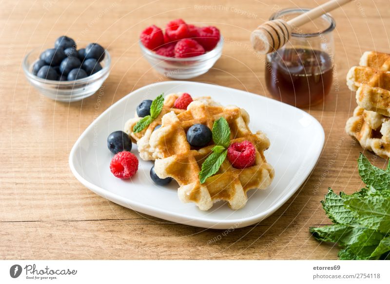 Traditional belgian waffles with blueberries and raspberries Waffle Blueberry Raspberry Mint Dessert Sweet Candy Fruit Healthy Healthy Eating Breakfast Food