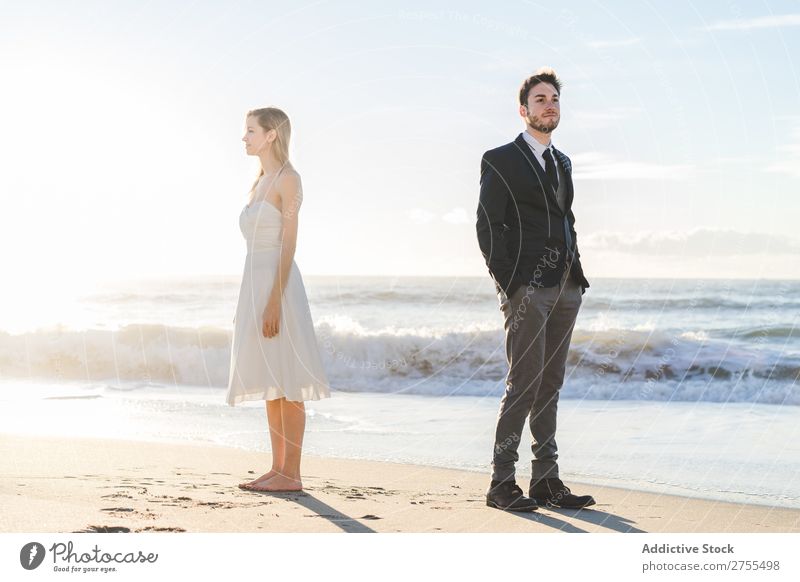 Bridal couple posing on sunny beach Couple Bride Groom Beach dreamers romantic back to back in love Youth (Young adults) Posture Love Together Happiness Style