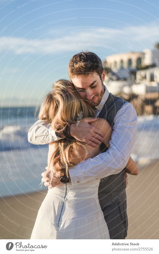 Man embracing bride in sunlight Couple Wedding Embrace tender Back in love Self-confident Engagement Sun romantic Love Bride Groom Dress Emotions Bright Idyll