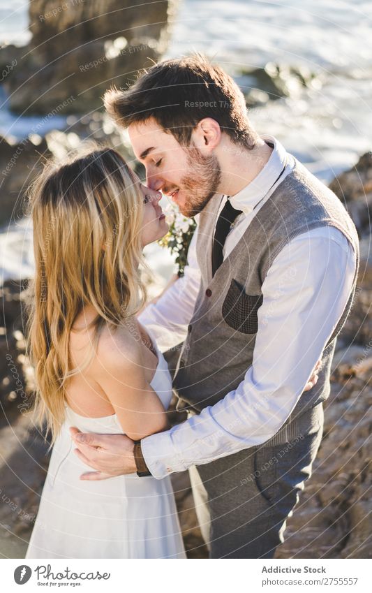 Sensual wedding couple kissing on shoreline Couple bridal Kissing Beach tender in love Wedding Expression romantic Feasts & Celebrations eyes closed Style
