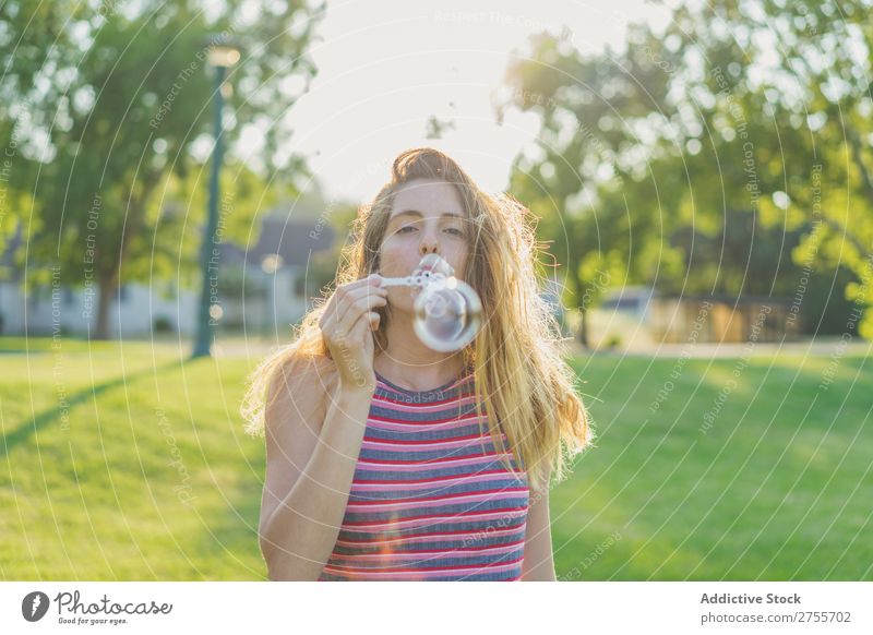 Woman making soap bubbles Park romantic Soap bubble handsome Youth (Young adults) Blow Playful Easygoing Modern Magic Posture Summer Playing Happiness Beautiful