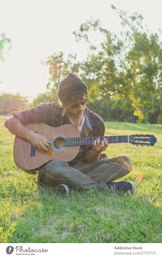 Man playing guitar on nature Park Guitar Summer Playing Landscape Hipster Musician Dream Nature Lifestyle romantic Vacation & Travel singing Easygoing