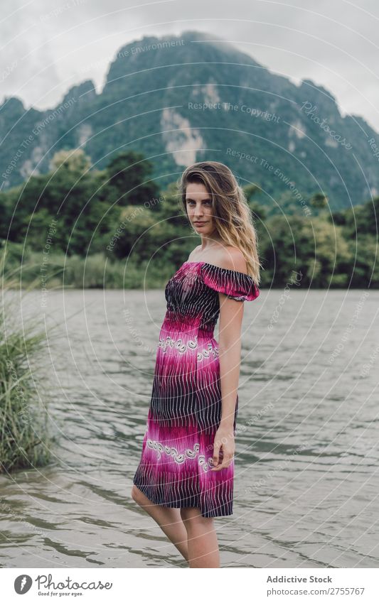 Pretty woman standing on lake Woman pretty Posture Nature Lake Mountain Stand Forest Green Sunbeam Day Beautiful Beauty Photography Natural Youth (Young adults)
