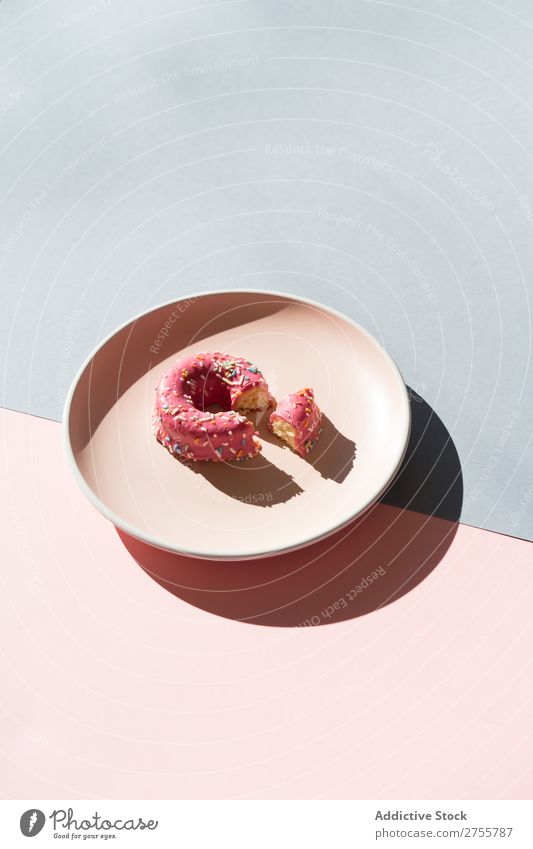 Delicious doughnut on plate composition Donut Multicoloured glazed minimalist geometric Plate Symmetry Confectionary Arrangement Sweet Dessert Colour Pink