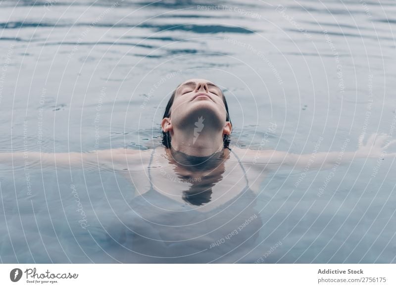 Woman with closed eyes in water Lie (Untruth) Swimming Face upside down Swimming pool Water Human being Summer Blue Vacation & Travel Resort Action Relaxation
