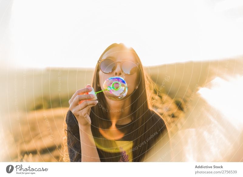 Woman blowing soap bubble in nature pretty Nature Bubble Soap Blow Sunglasses Sunbeam Beautiful Portrait photograph Youth (Young adults) Beauty Photography
