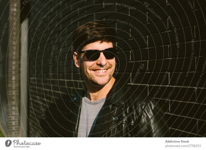 Cheerful man in sunglasses cheerful smiling happy confident young cool person portrait modern model fashionable male serious casual handsome guy adult caucasian