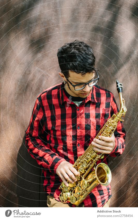 Young musician with sax Musician Man Youth (Young adults) Jazz Saxophone instrument Musical Performance Saxophon player Human being Player Acrobat Entertainment