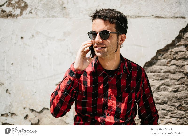 Stylish man talking phone Man PDA To talk Wall (building) Sunbeam Mobile handsome Style Cool (slang) Telephone Portrait photograph Lifestyle Communication