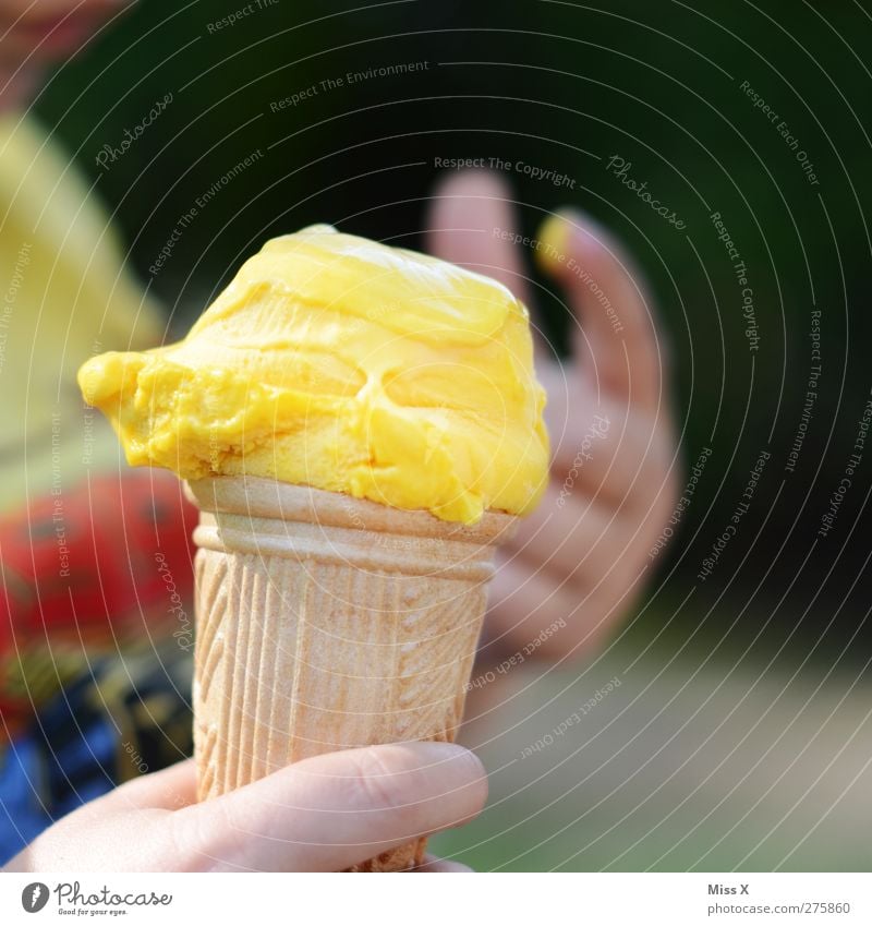 ice Food Ice cream Nutrition Eating Child Hand Fingers Cold Delicious Yellow Ice-cream cone Vanilla ice cream Vanilla pod Lick Summer Colour photo Multicoloured